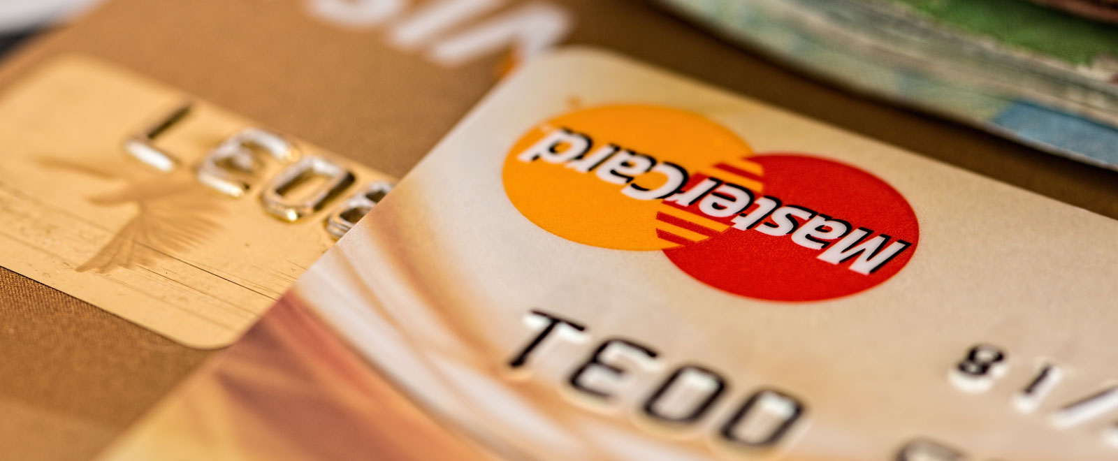 A close up of a Mastercard logo on a credit card.