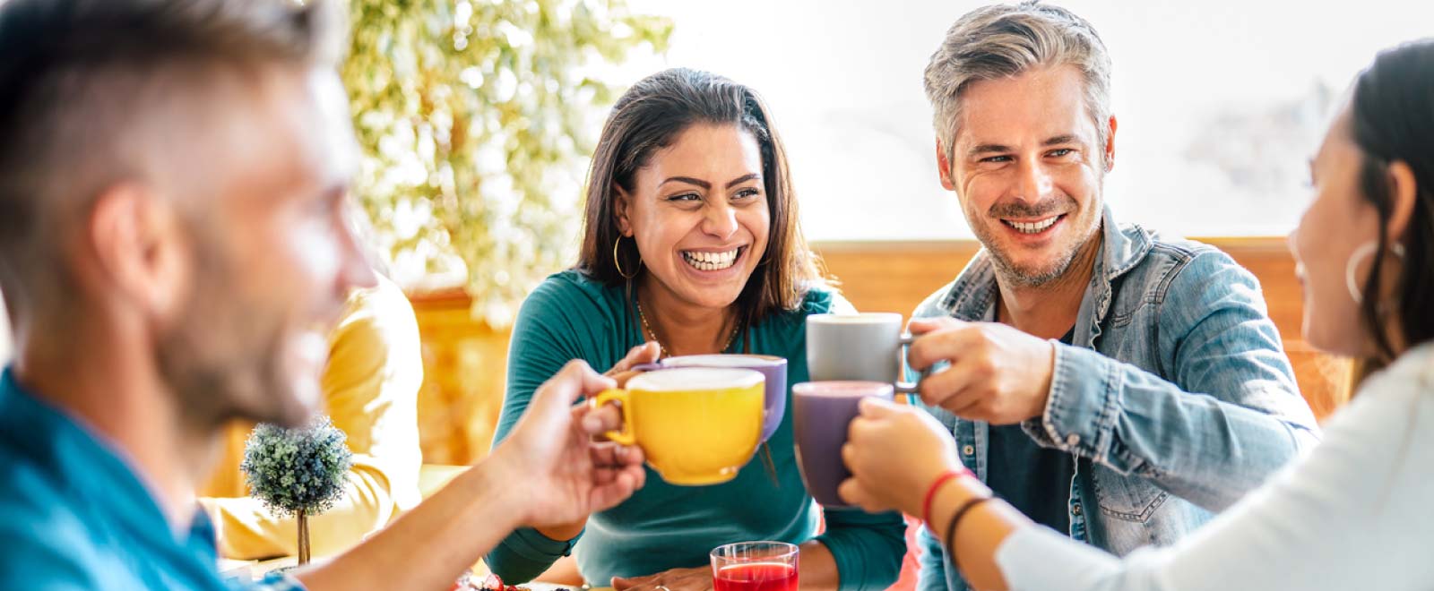 group of adult friends enjoying coffee