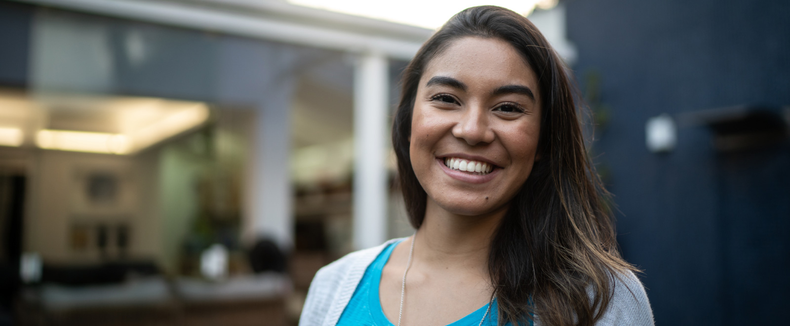 Smiling woman with a fixed rate 90 day payment deferral personal loan from KEMBA's Columbus branch.