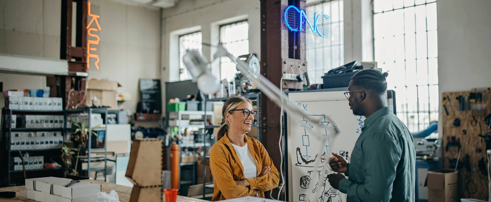 Woman and man coworkers in a print shop.