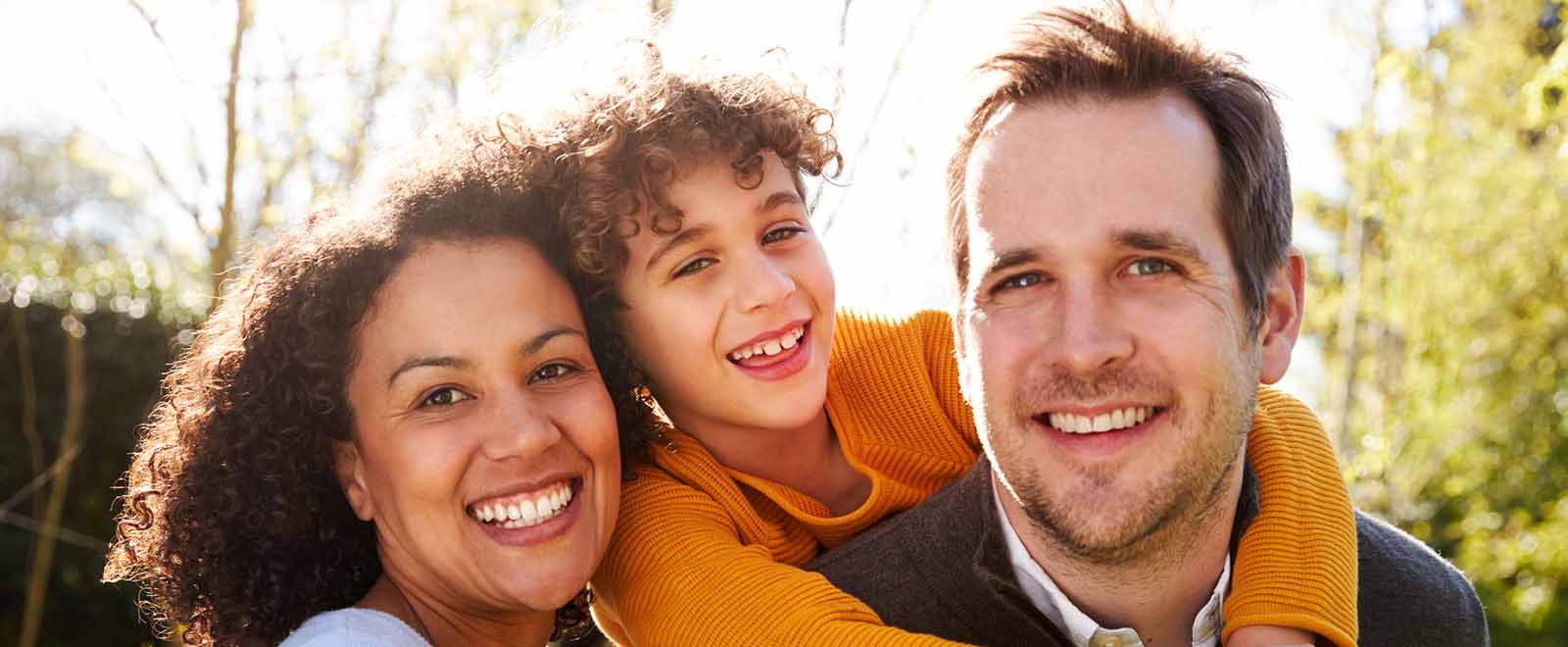 Happy family enjoys cash back rewards outdoors.