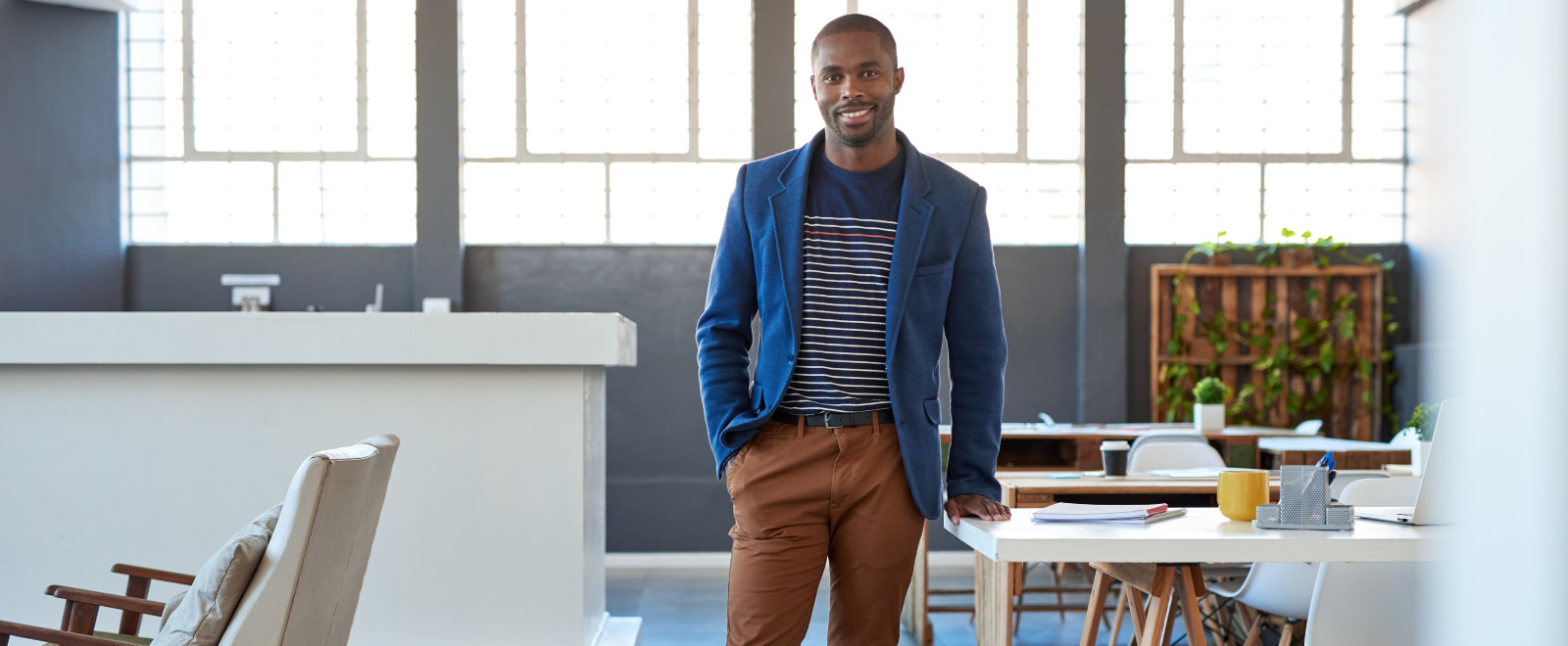 Young smiling business owner in Columbus Ohio who recently switched to KEMBA Financial Credit Union.