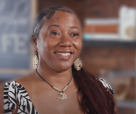 A woman smiling during an interview.