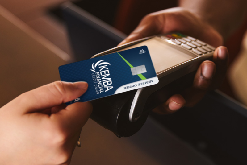 Someone using their KEMBA Member Owner Visa to tap to pay.