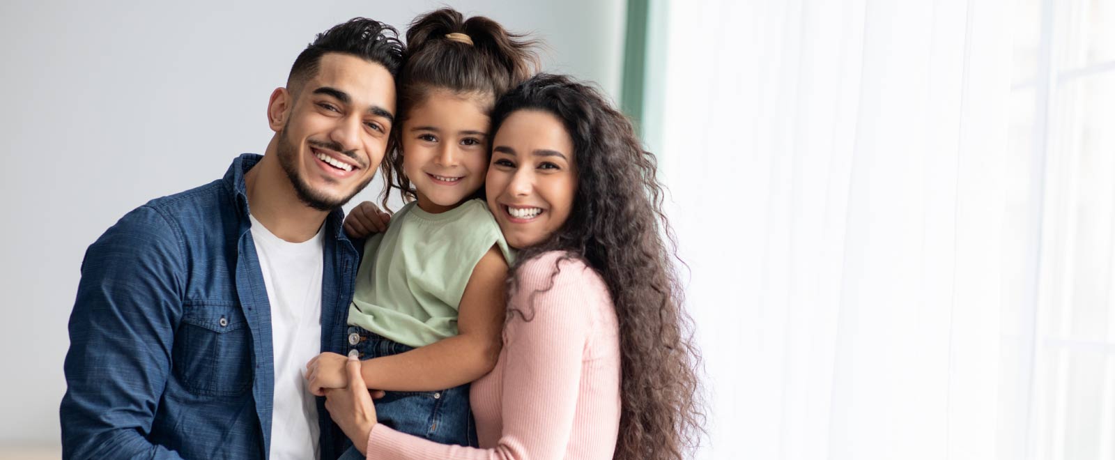 Smiling family planning and saving for future milestones with a money market account