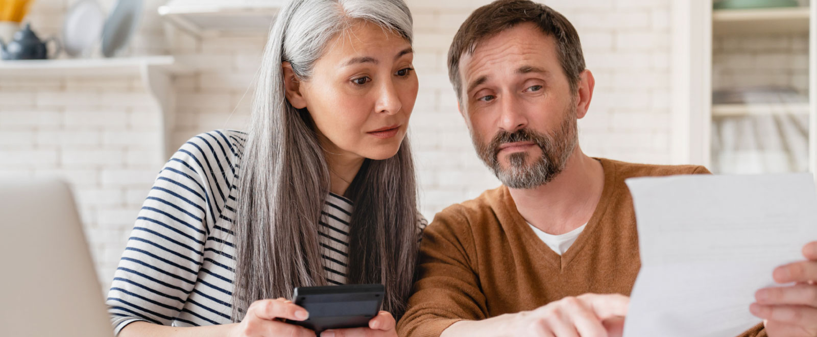 mature couple reviewing finances