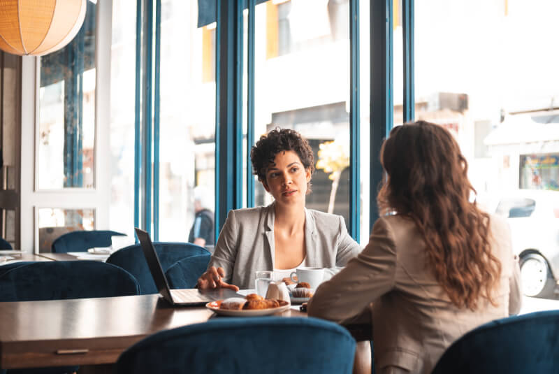 two professional woman in a meeting