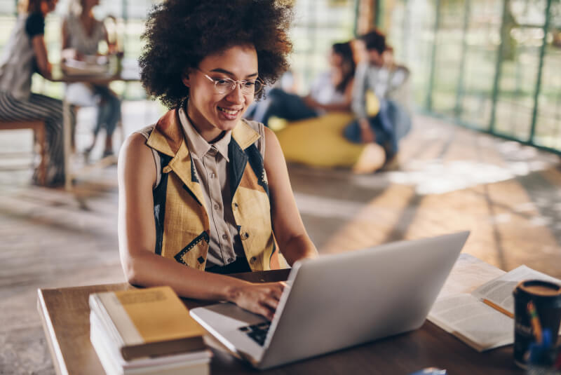 woman using laptop in open office