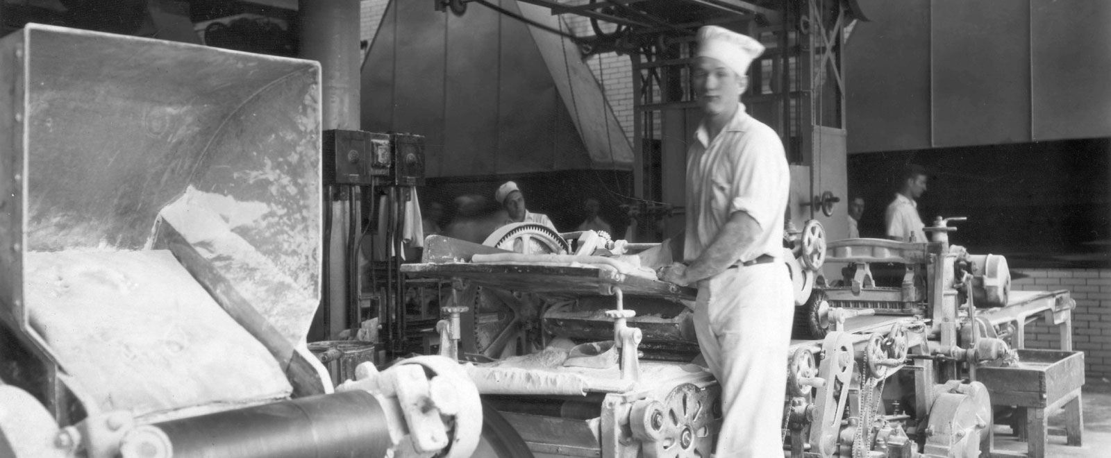 black and white photo of old Kroger Bakery and baker