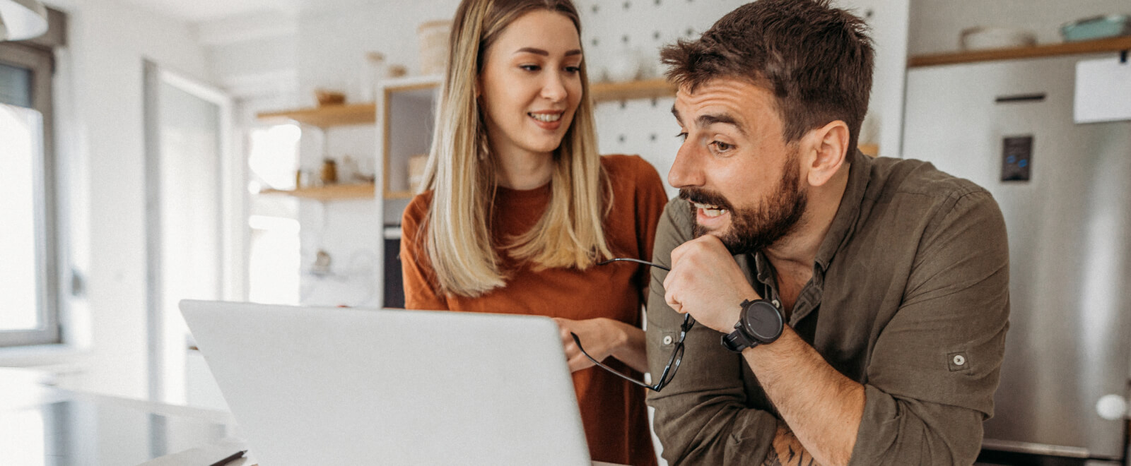 Young man and woman looking at a computer.