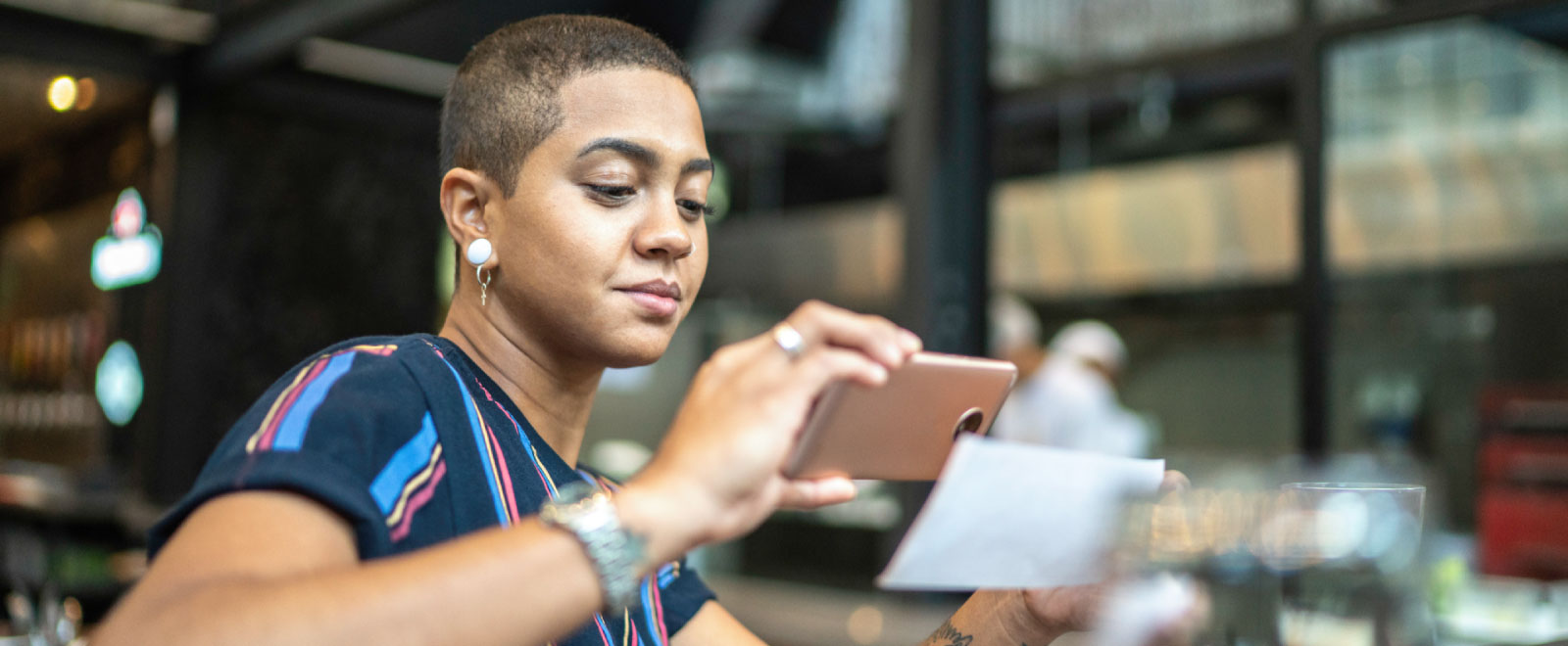 woman using Remote Deposit to deposit paper check