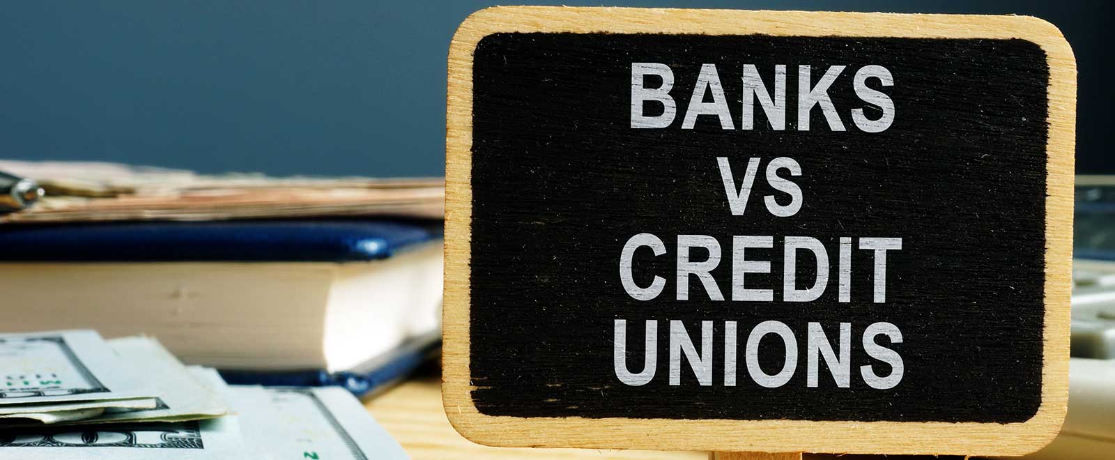 A board that says "Banks vs Credit Unions".
