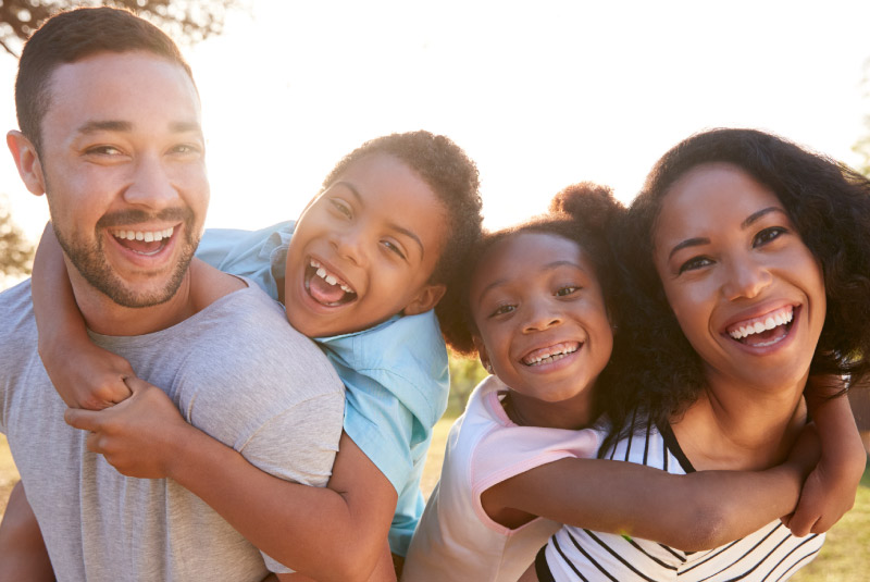 Happy family enjoying summer, earning more savings with a Money Market Account from KEMBA Financial
