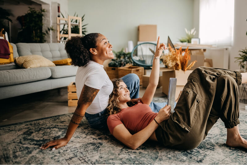 couple laying down and remodeling home