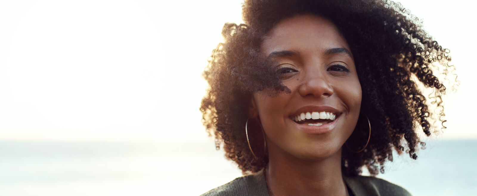 Happy young woman outdoors.