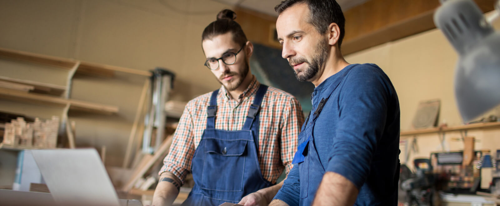 Two men working in a work shop.