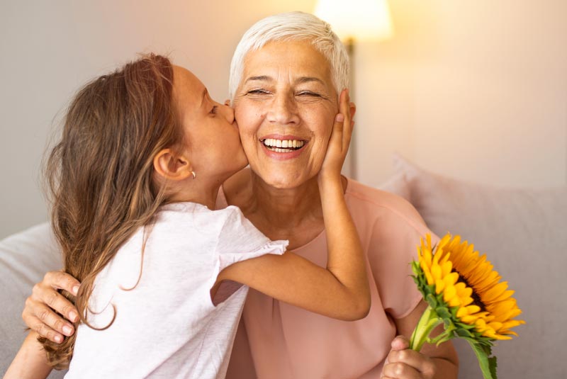 grandmother and grandchild smiling