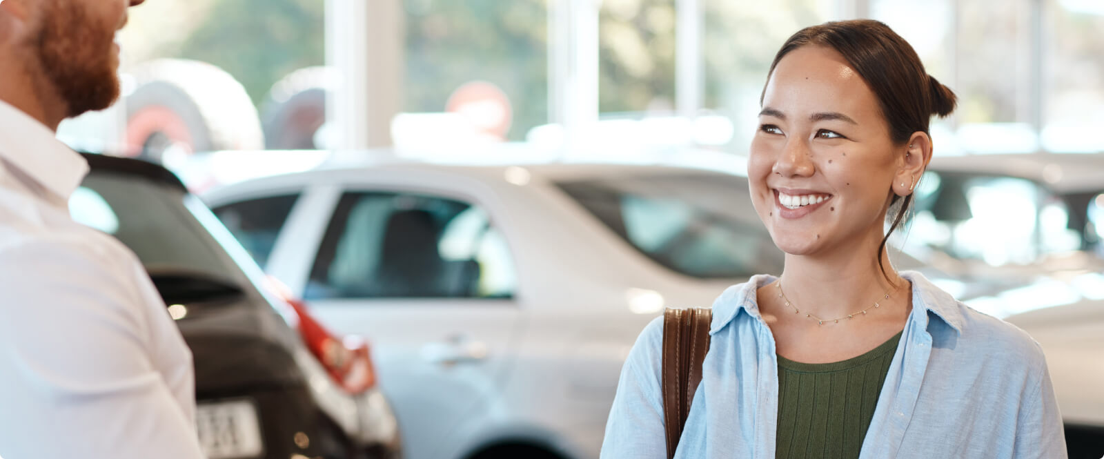 Woman in a car dealership